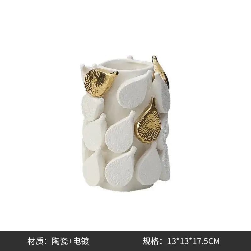 White ceramic vase with textured white and gold-toned leaves featuring lemon carambola design for living room decor