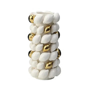 White ceramic vase with textured shell-like protrusions and gold black spheres in lemon carambola design for living room decor