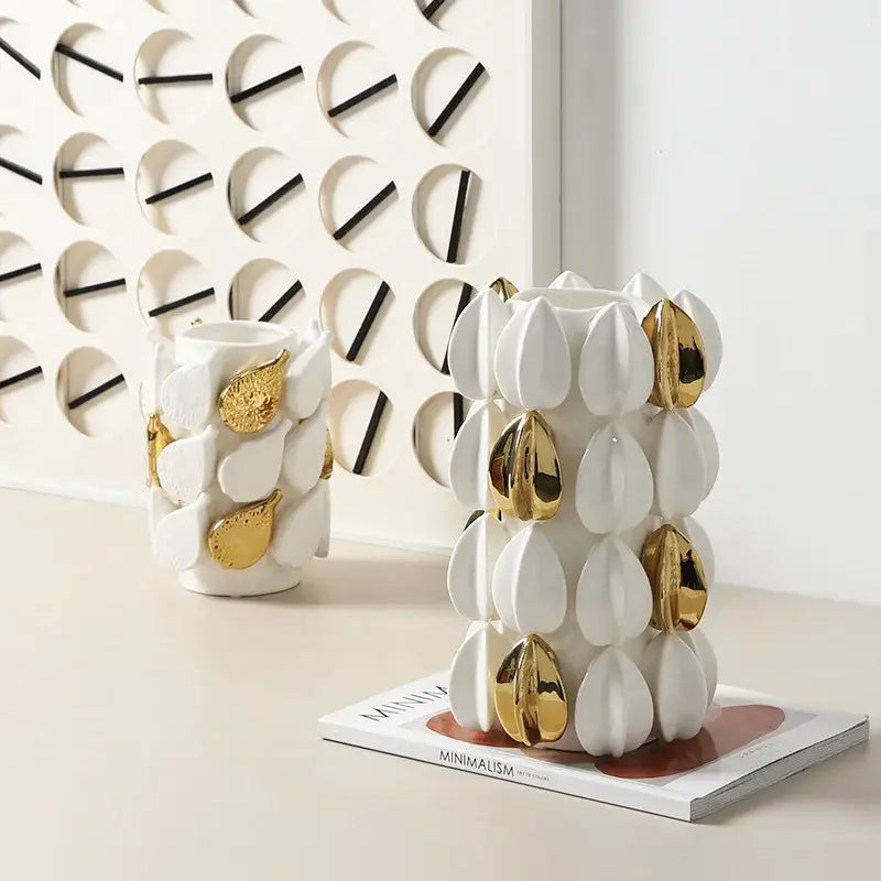 White ceramic vase with gold leaf accents featuring lemon carambola design for living room decor