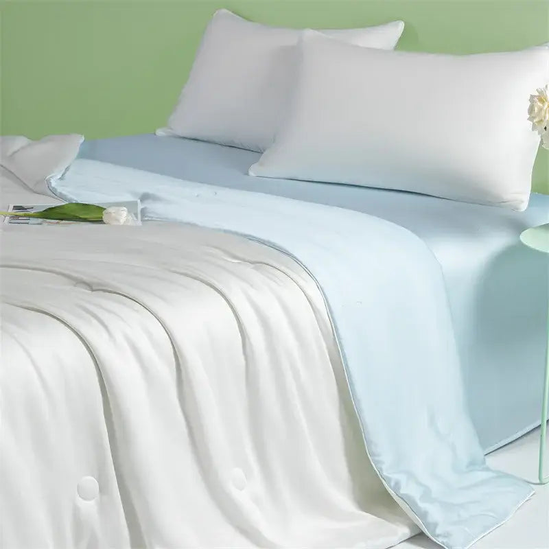 White satin-like quilted blanket with subtle button detailing from decorbites cool feel summer quilt collection