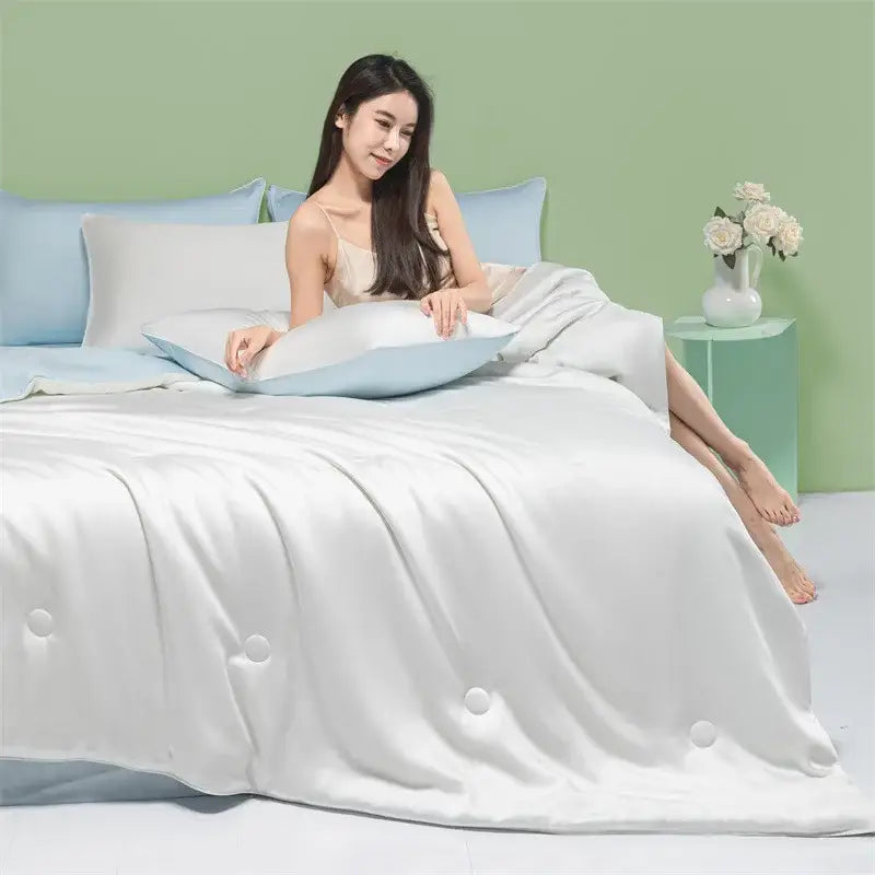 A luxurious white satin duvet cover with subtle sheen and button detailing for decorbites cool feel summer quilt