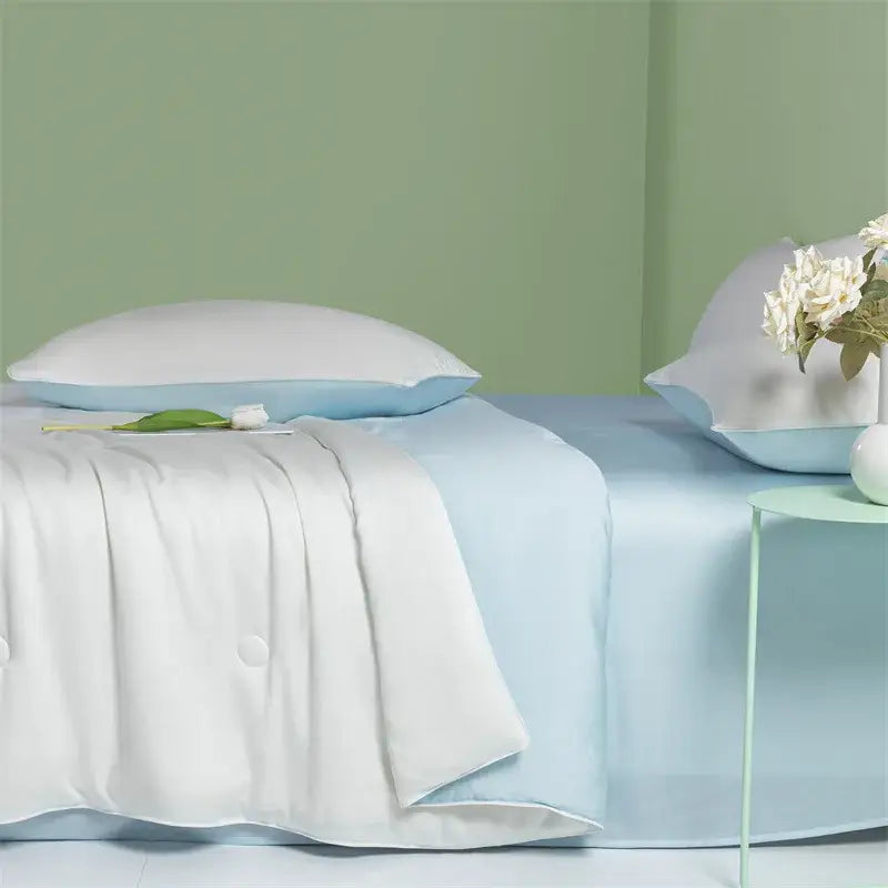 Light blue satin sheet set paired with white quilted comforter showcasing decorbites cool feel summer quilt design