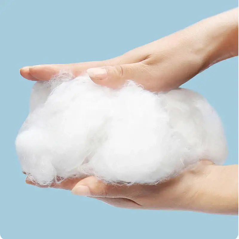 A soft fluffy white cotton fiber bundle held in hands for decorbites cool feel summer quilt bedroom blanket