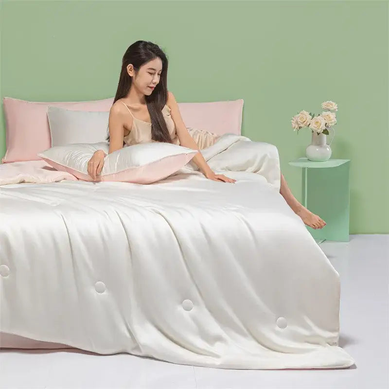 White satin duvet cover with subtle pink piping and decorative buttons from decorbites cool feel summer quilt collection