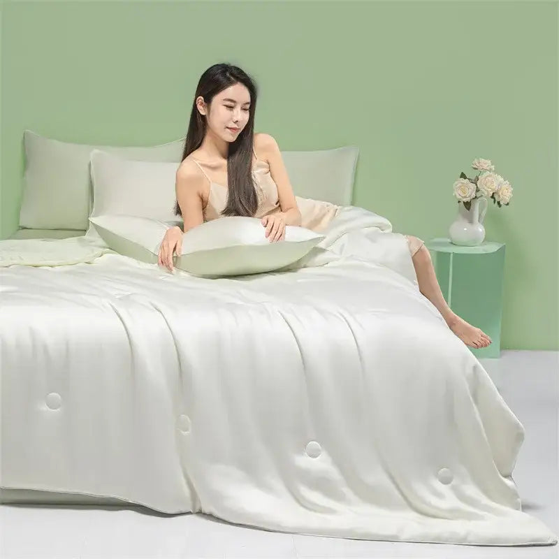 A luxurious white satin duvet cover with subtle button detailing for decorbites cool feel summer quilt bedroom use
