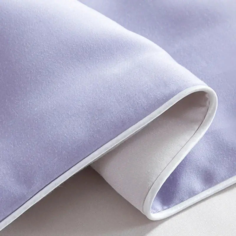 Soft lavender velvet pillowcase with white piping paired with white and light blue decorbites cool feel summer quilt