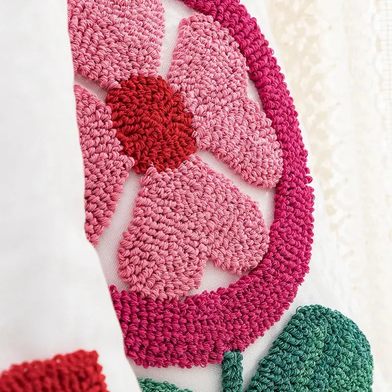 White love floral decorative sofa pillowcase featuring a vibrant pink and red crocheted flower on white fabric decorbites decorative