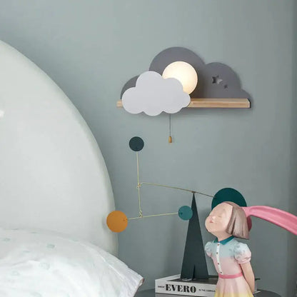 White macaron led cloud wall lamp with warm glow and layered gray and white cutout clouds on wooden shelf for children bedroom