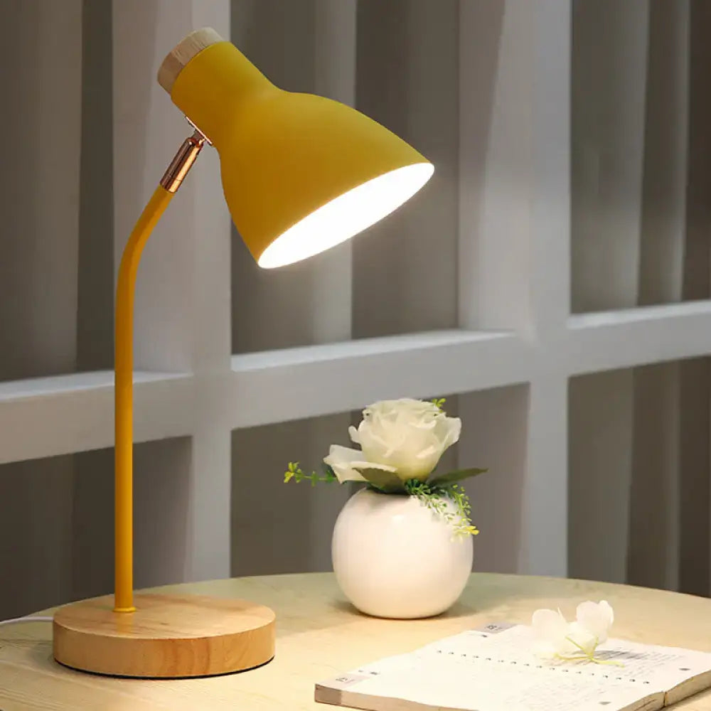 Yellow desk lamp with wooden base and brass joints as part of a white pink green macaron metal adjustable table light