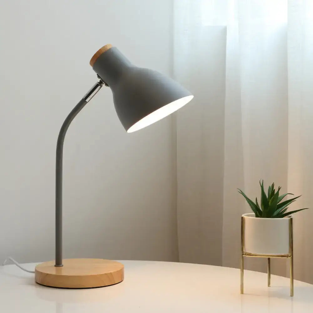 Gray macaron metal table light with wooden base and adjustable gooseneck design for bedroom use