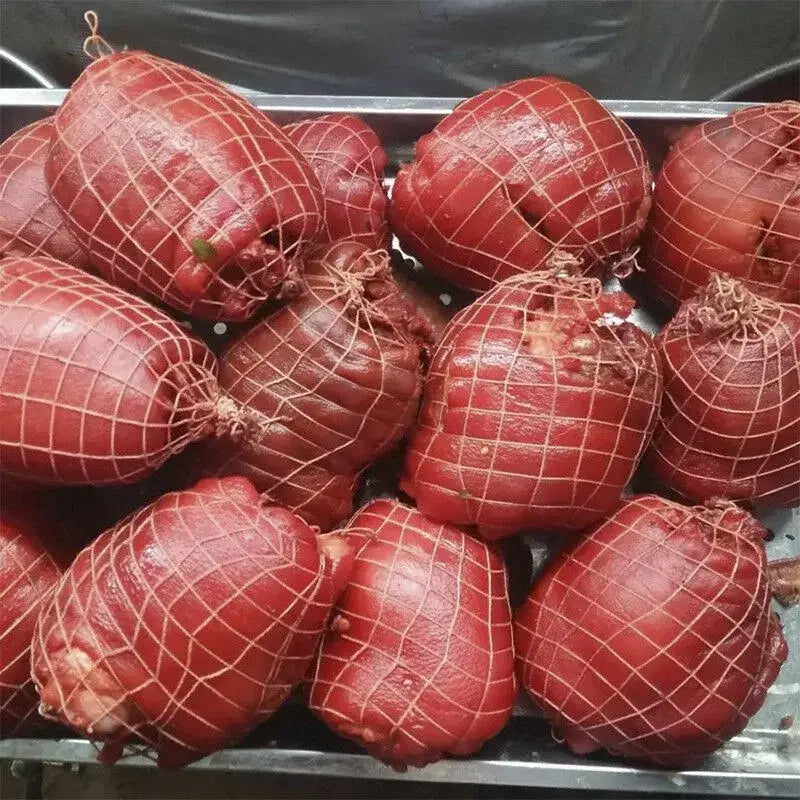 Red cured pork hams wrapped in white mesh bbq net bundle for kitchen pork roasting and bbq net use