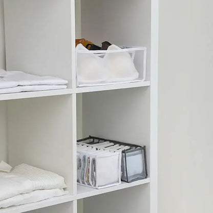 Clear plastic lingerie organizer box set with white fabric lining and black trim for bedroom wardrobe storage