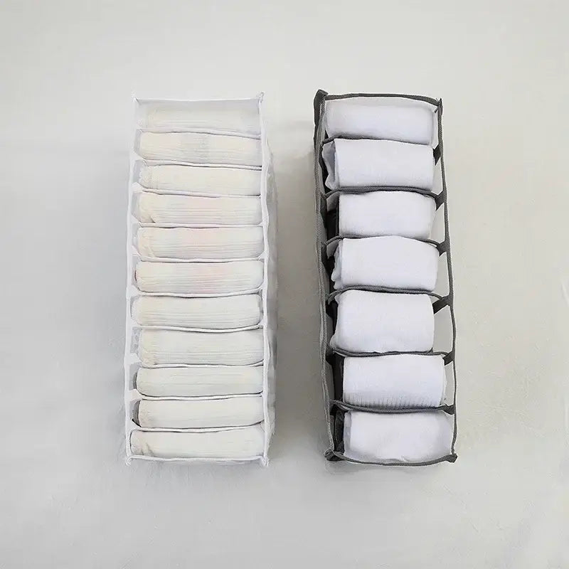 Two fabric drawer organizers white and gray holding folded white socks in a white mesh underwear organizer box set