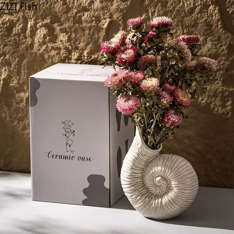 White nautilus conch ceramic vase with intricate spiral ridges for bedroom and office decor by decorbites conch ceramic