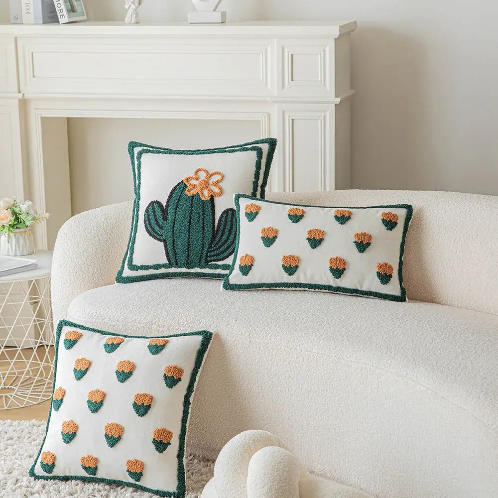 White pillow cover with green and orange decorbites cactus embroidery and textured fringe border for living room decor
