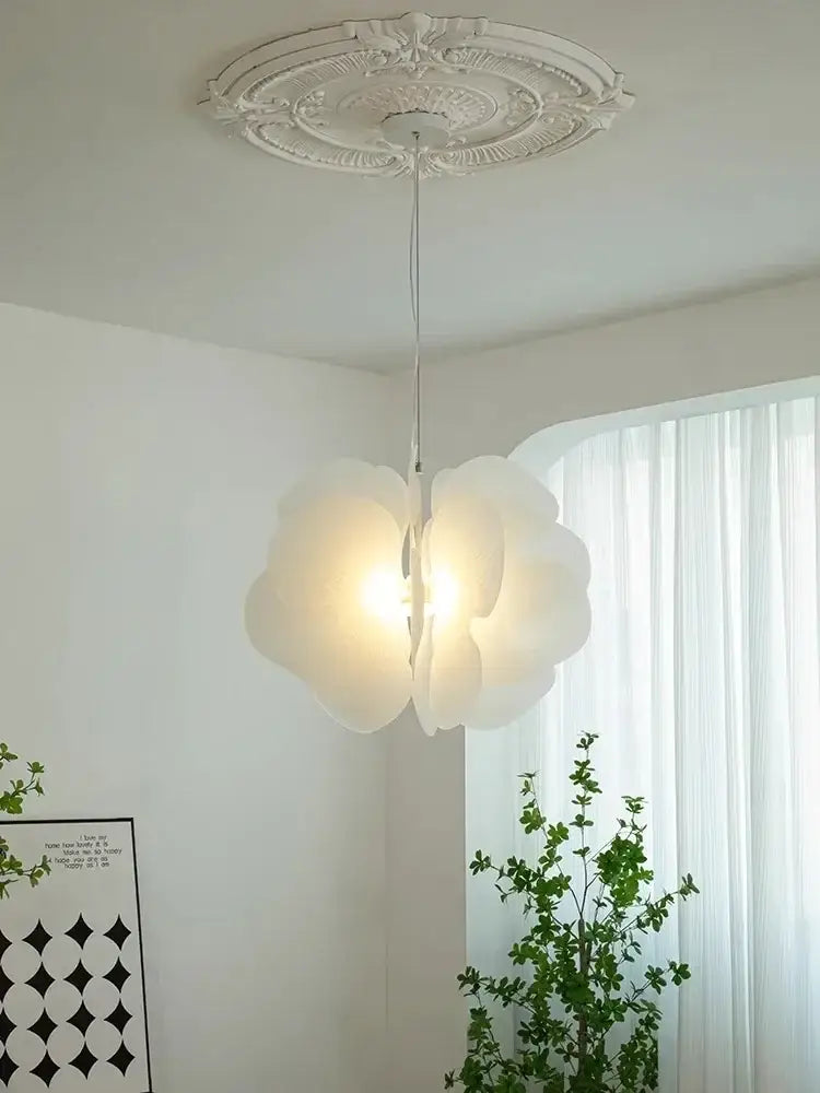A delicate white paper flower butterfly pendant light with soft glow hanging from an ornate ceiling medallion decorbites butterfly pendant light