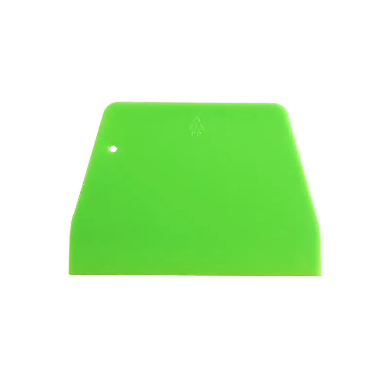 Bright green plastic cream cake cutter spatula with rounded top edge and hole, ideal for dough cream cake slicing