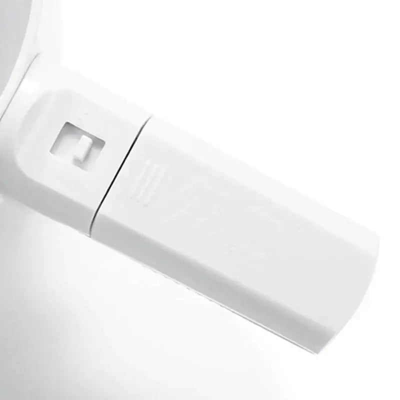 White plastic electric flour sifter shaker with rectangular usb flash drive style body and square cutout side detail
