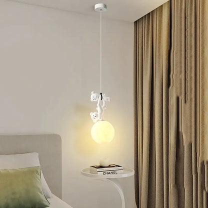 White ceramic plush bear pendant lamp with two teddy bears climbing rope above bulb for nursery room lighting