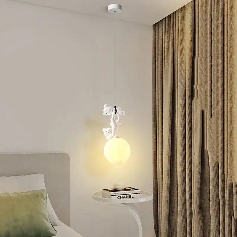 White ceramic plush bear pendant lamp with two teddy bears climbing rope above bulb for nursery room lighting