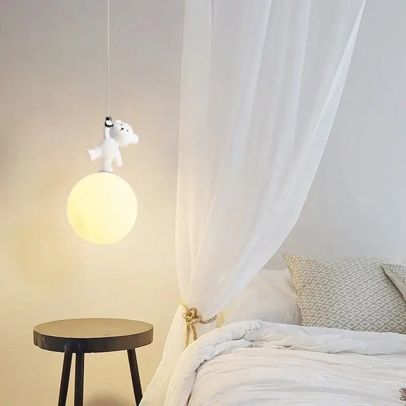 White plush bear nursery room pendant lamp with round softly glowing yellow bulb for nursery room lighting