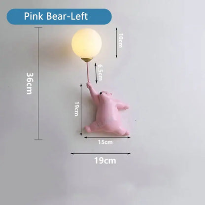 Pink bear night light with round warm-toned glass globe and gold metal stem for kids bedroom moon lamp