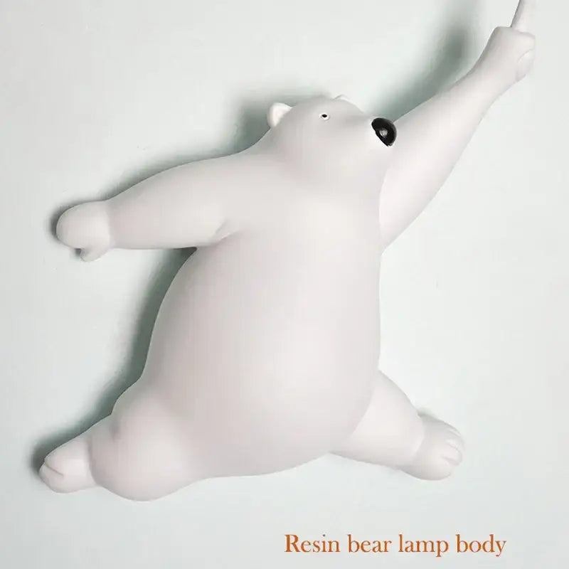 White resin polar bear night light with black eyes and outstretched arms for kids bedroom use