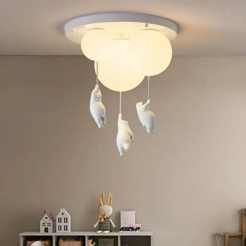 White polar bear resin pendant light with cloud-shaped ceiling fixture and dangling bunny figurines for childrens room