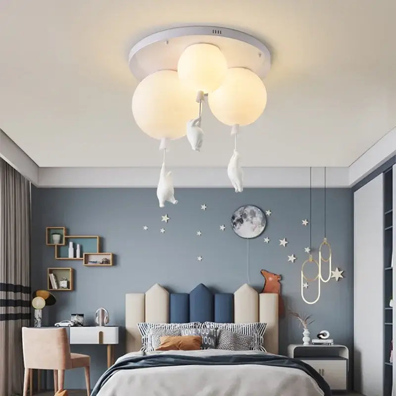 Cream-colored cloud-shaped resin pendant light with dangling white rabbit figurines for childrens room decor