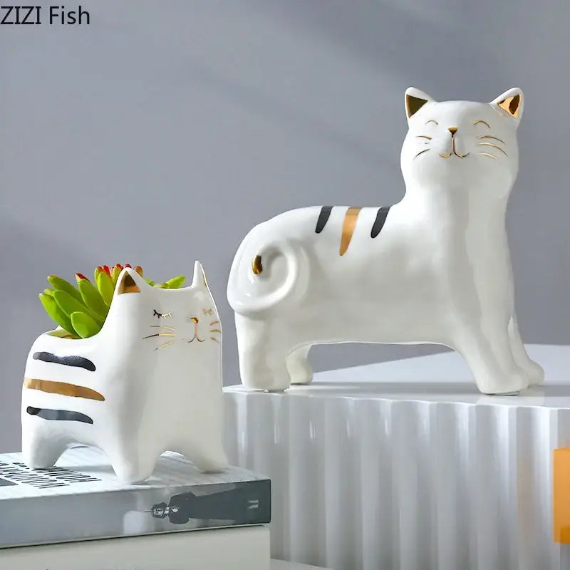White porcelain cat vase with gold trim and black stripes by decorbites serving as a succulent planter and decorbites cat vase