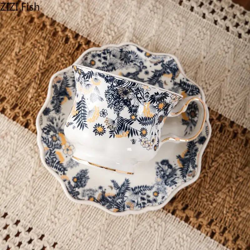 White porcelain classic scalloped tea cup set with intricate navy blue and gold floral pattern for elegant dining