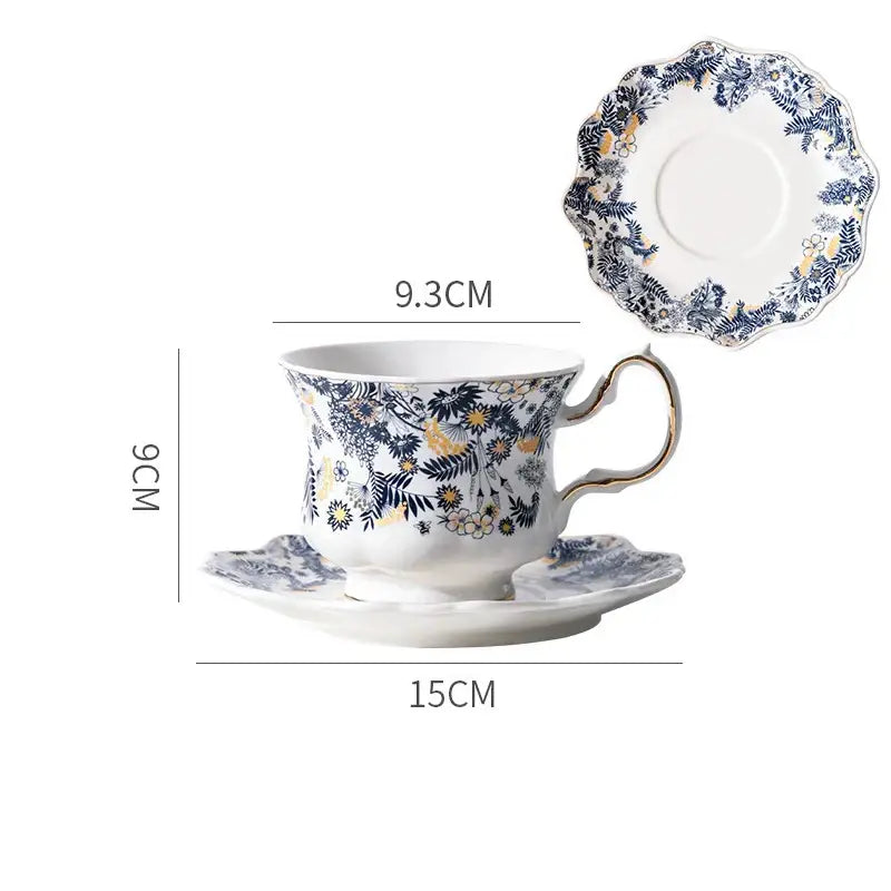 Elegant white porcelain classic tea cup with navy and gold floral pattern scalloped rim and gold-trimmed handle