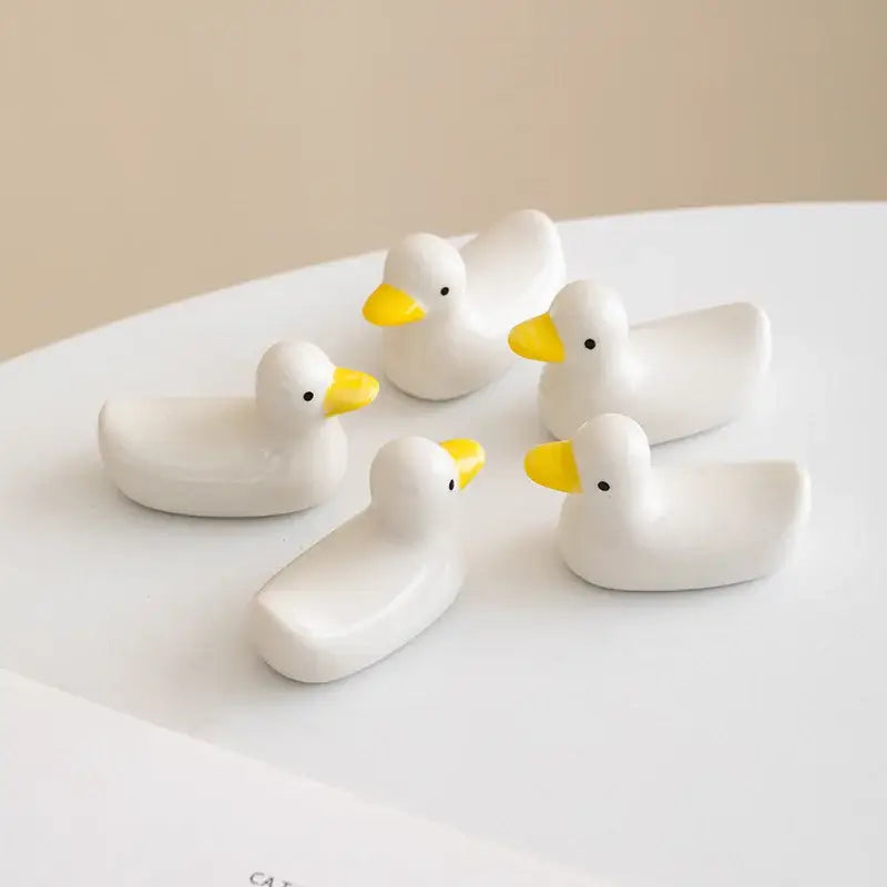 White porcelain duck chopstick holder tray with yellow beaks and black eyes ceramic dish for dining room use