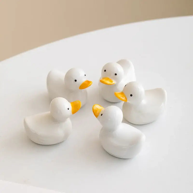 White porcelain duck chopstick holder tray with bright yellow beaks black eyes ceramic dining room dish