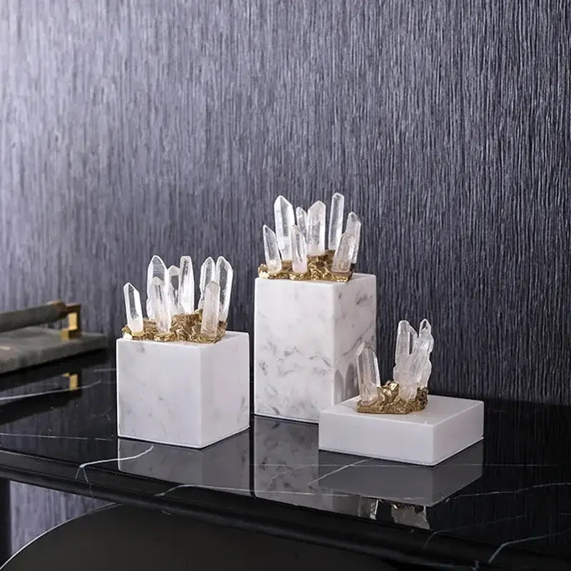 Set of three white quartz crystal stone marble cube bases with gold-toned accents for living room decor