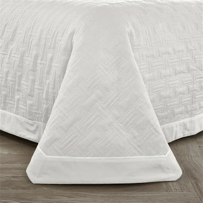 White quilted cotton coverlet bedspread set with subtle woven texture and neatly finished hem for bedroom decorbites decor