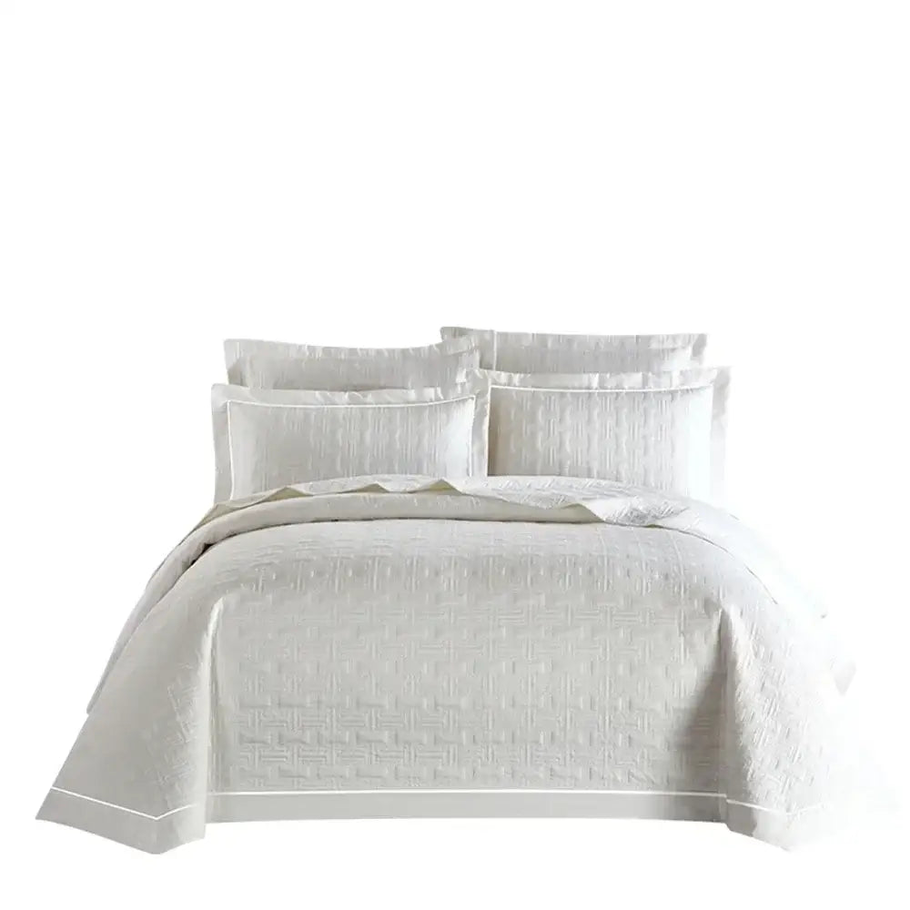 White quilted cotton coverlet bedspread set with subtle woven pattern and elegant piping for bedroom decorbites decor