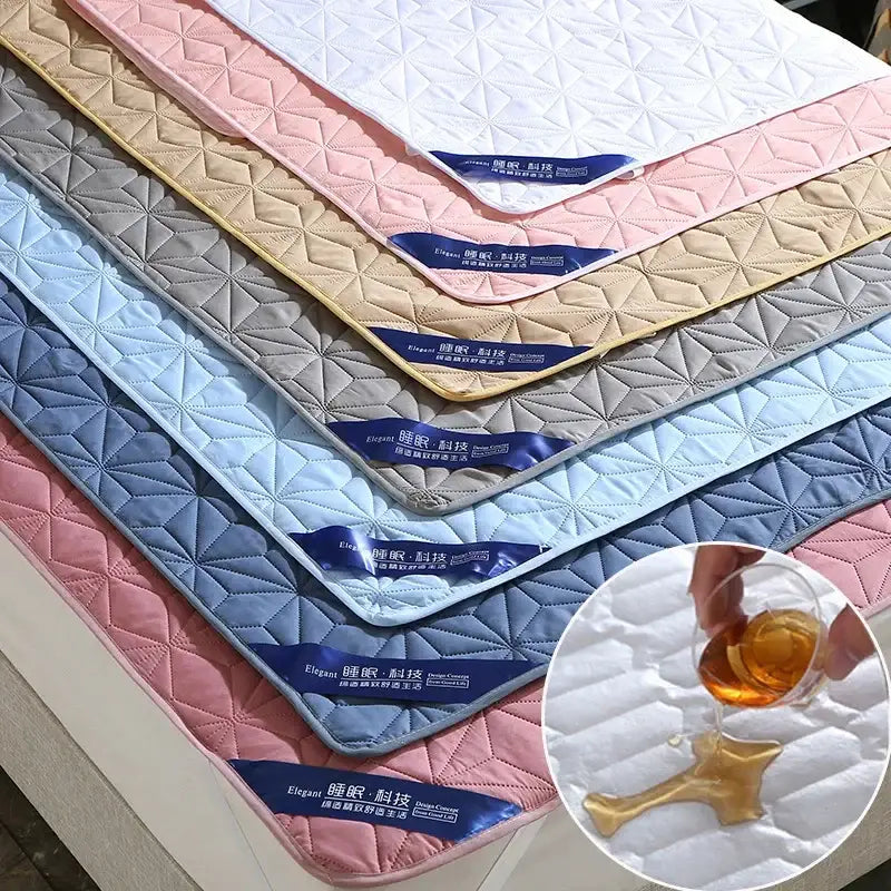 Soft quilted cooling bed protector pad in pastel pink and blue with diamond-stitched pattern for bedroom use