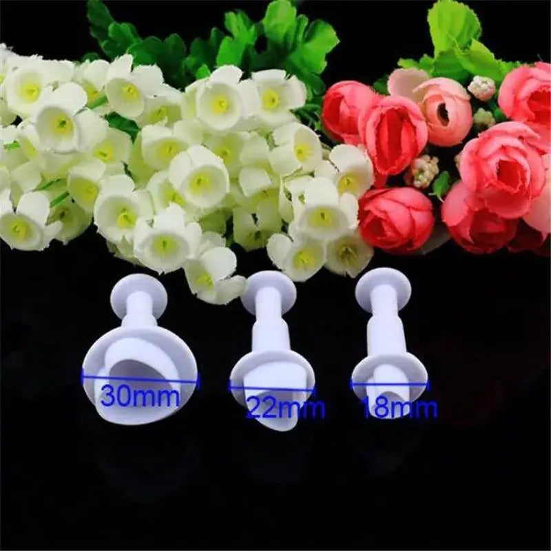 Set of three white plastic star cake decorating cookie cutters in 18mm, 22mm, and 30mm for cake decorating