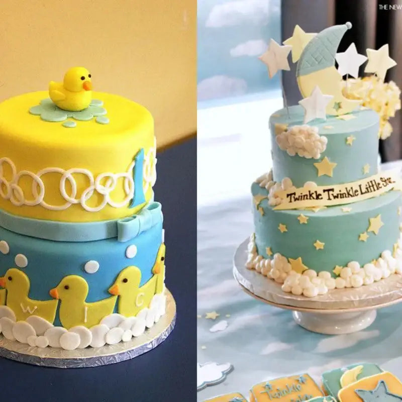 Yellow and blue two-tiered baby shower cake with fondant ducks and clouds featuring star cake decorating cookie cutter set