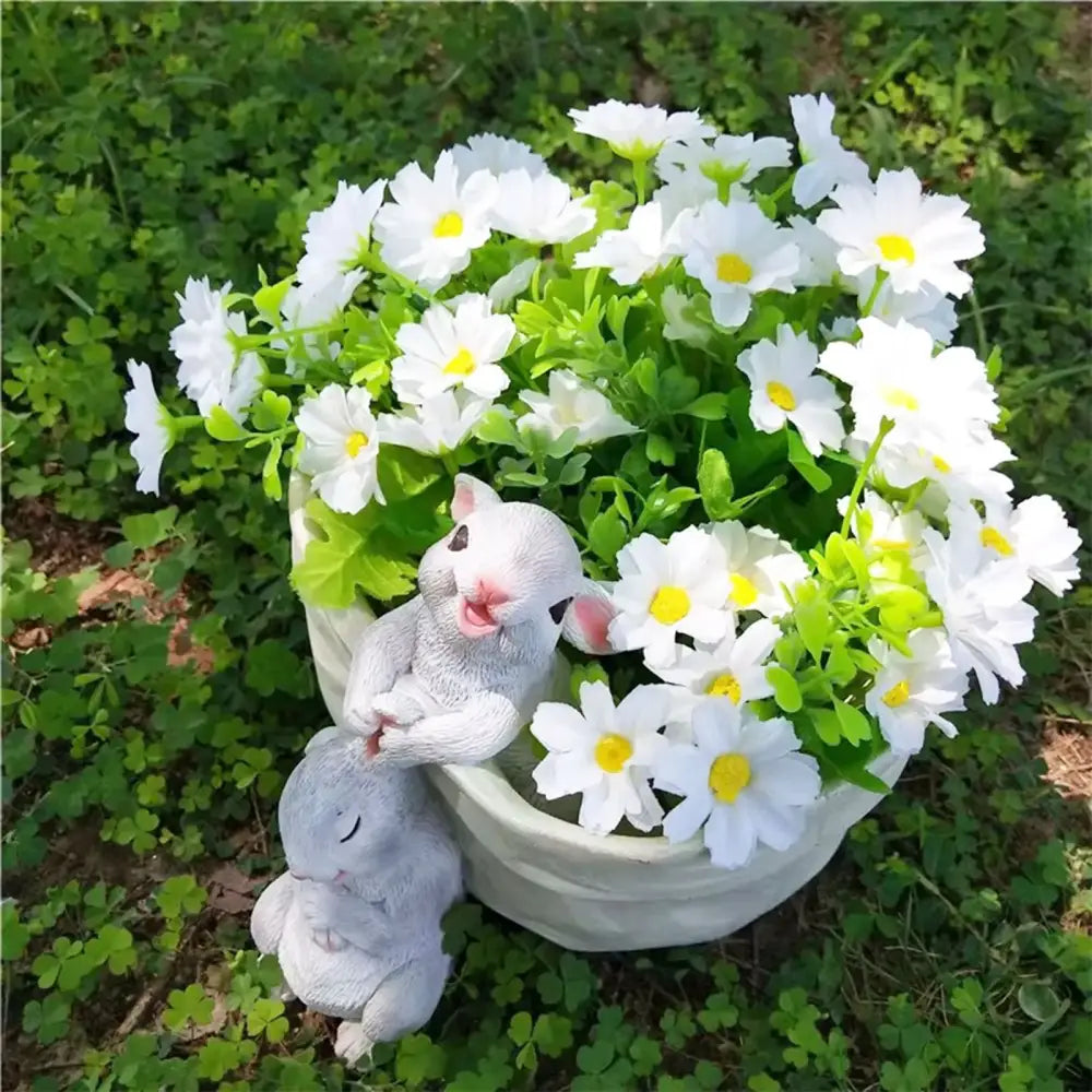 White resin bunny succulent planter pot featuring two gray resin bunny figurines and artificial daisies decorbites bunny succulent