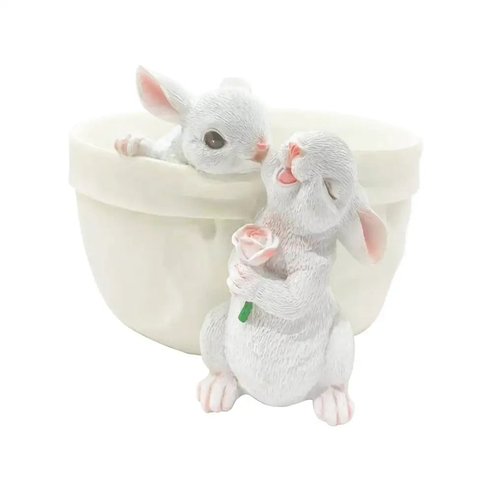 White resin bunny succulent planter pot featuring two rabbits with a pink rose for decorbites bunny succulent decor
