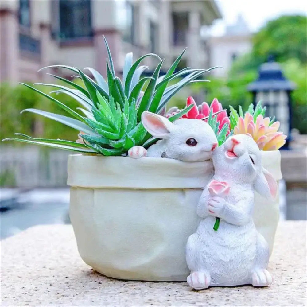 White resin bunny succulent planter pot featuring two sculpted rabbits with one holding a pink rose for garden decorbites bunny succulent decor