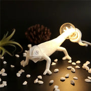 White resin decorbites chameleon night light with glowing bulb held in its mouth ideal for bedroom reading lamp
