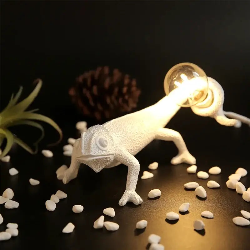 White resin decorbites chameleon night light with glowing bulb held in its mouth ideal for bedroom reading lamp