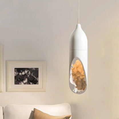 White Resin Farmhouse Pendant Light with Unique Pill Shape and Hollow-out Design