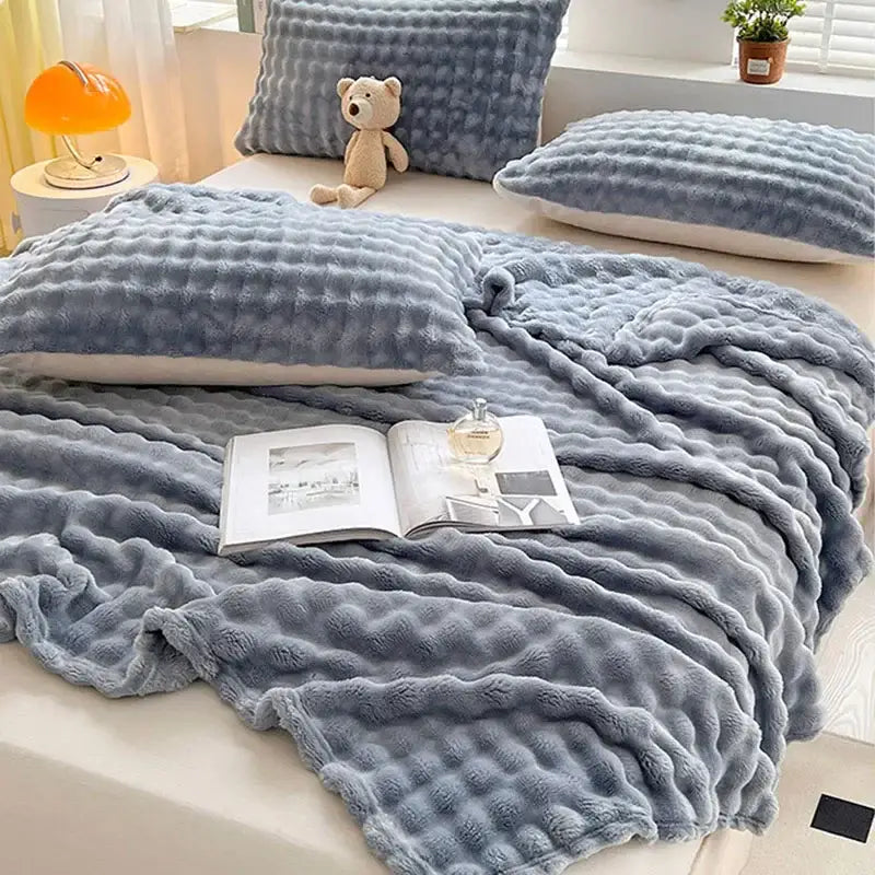 Soft plush gray quilted decorbites bubble velvet blanket with textured fluffy surface for cozy bedroom decor