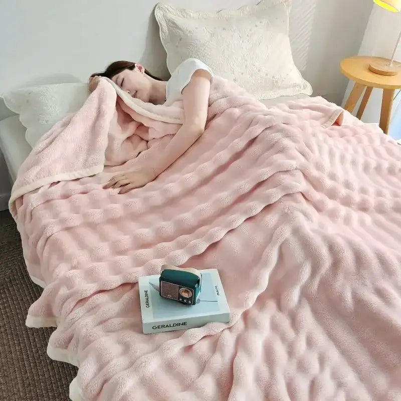 A soft pink decorbites bubble velvet blanket with quilted textured surface for plush bedroom decor and throw use