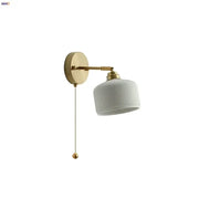 White ribbed ceramic led wall sconce with gold-toned metal arm and pull chain for decorbites ceramic led lighting