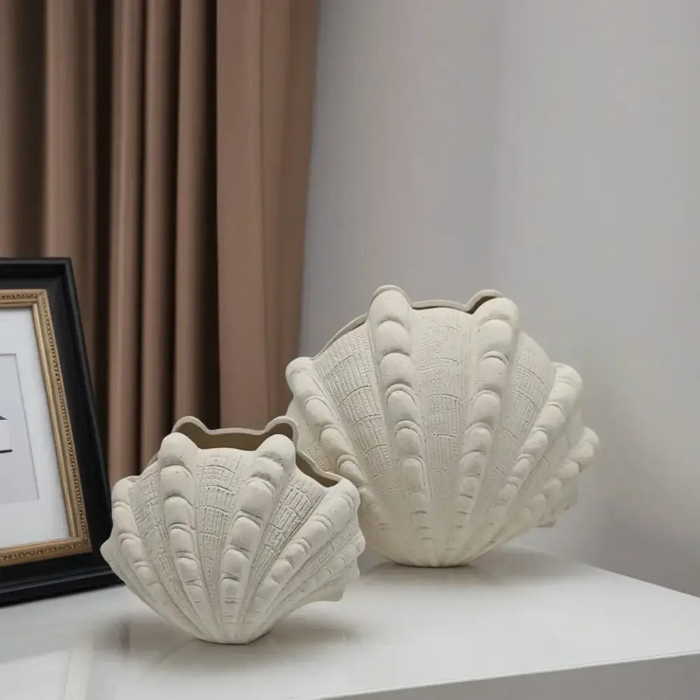 Cream-colored ceramic clam shell vase with detailed ridged texture ideal for living room decor from decorbites ceramic clam collection